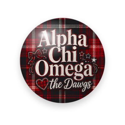 Alpha Chi Omega #059 button. Red and black plaid background with the full name spelled out in cream serif, a plaid heart, cream script “the Dawgs”, a bow and stars.