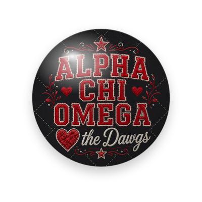 Alpha Chi Omega #060 button. Black quilted background with the full name spelled out in red stitched varsity letters, red hearts, cream script “the Dawgs” and stars.