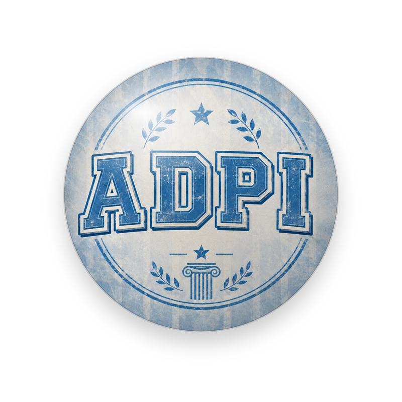 Alpha Delta Pi #046 button. Faded blue and cream striped background with distressed blue varsity “ADPI”, laurels, a star and a column.