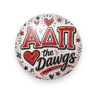 Alpha Delta Pi #068 button. Speckled cream background with red block Greek letters outlined in black, a red heart, black script “the Dawgs”, hearts and stars.