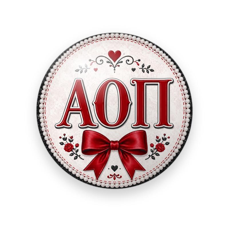 Alpha Omicron Pi #051 button. Cream center with a pearl border, red serif Greek letters, a big red satin bow, roses and hearts.