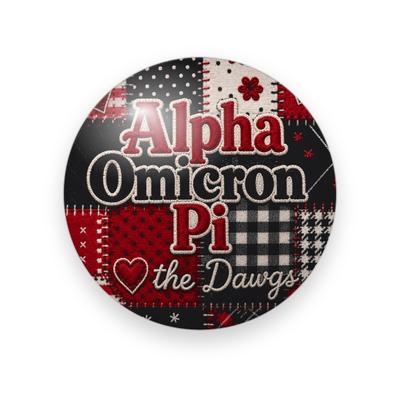 Alpha Omicron Pi #052 button. Red, black and cream patchwork with the full name in red and cream serif, a heart and cream script “the Dawgs.”
