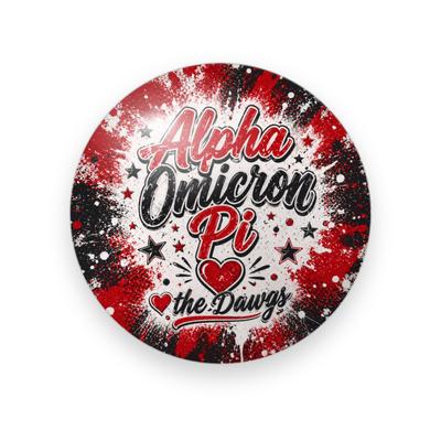 Alpha Omicron Pi #053 button. Red and black spray-paint burst with the full name in red and black script, a heart, “the Dawgs” and stars.