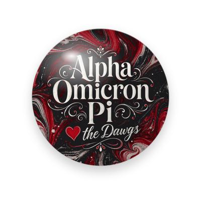 Alpha Omicron Pi #054 button. Red, black and white marbled background with the full name in cream serif with flourishes, a red heart and white script “the Dawgs.”