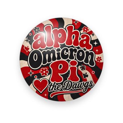 Alpha Omicron Pi #056 button. Red, black and cream retro swirl with the full name in red and black bubble letters, a red heart, red script “the Dawgs” and flowers.