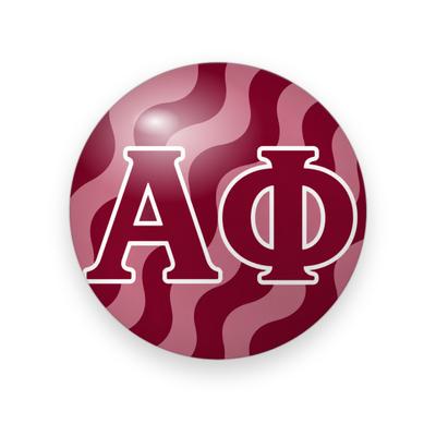 Alpha Phi #077 button. Maroon and pink wavy striped background with maroon Greek letters outlined in white.