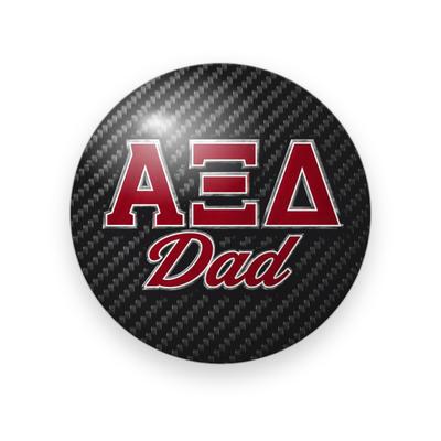 Alpha Xi Delta #037 button. Black carbon fiber background with red Greek letters outlined in silver above red script “Dad.”