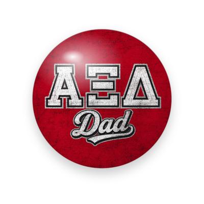Alpha Xi Delta #039 button. Distressed red background with white distressed block Greek letters and white script “Dad.”