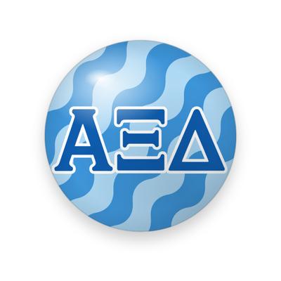 Alpha Xi Delta #045 button. Light and medium blue wavy background with royal blue Greek letters outlined in white.