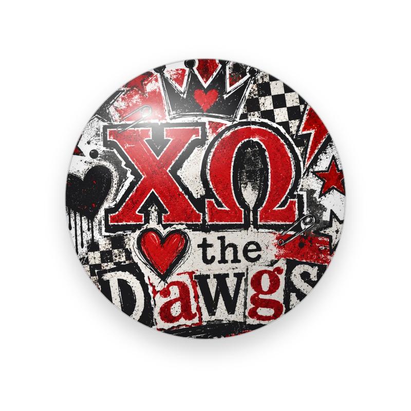 Chi Omega #027 button. Punk collage of torn red, black, and white paper with checkerboard, red Greek letters, a crown, a red heart, and ransom-style “the Dawgs” lettering.