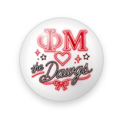 Phi Mu #023 button. White background with glowing red neon Greek letters, an outline heart, black and red script “the Dawgs,” a bow, and stars.