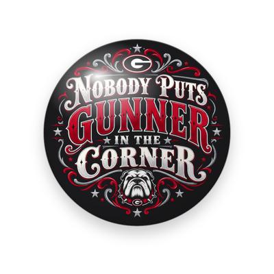 UGA #072 button. Black background with red scrollwork, a small “G” emblem, “Nobody Puts Gunner in the Corner” in silver and red serif capitals, and a bulldog.