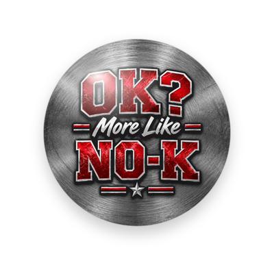 UGA #073 button. Brushed steel background with “OK?” in red block capitals, “More Like” in white script, and “No-K” in red with a star.