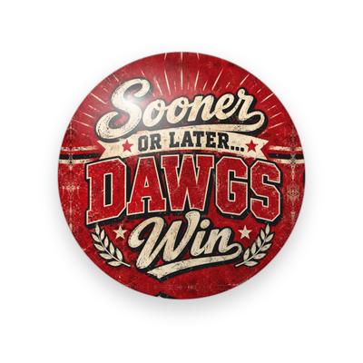 UGA #075 button. Distressed red sunburst background with “Sooner or Later… Dawgs Win” in cream script and bold red block capitals framed by laurels.